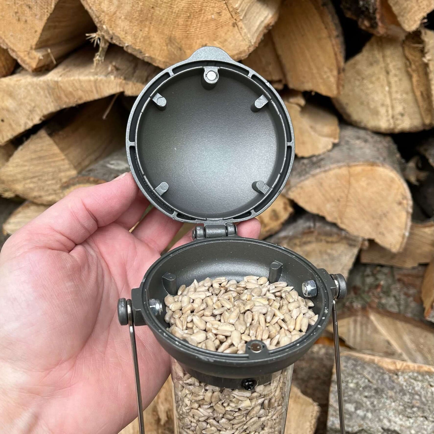 Pewter seed feeder with easy to use flick up lid for easy filling.