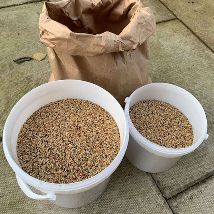White Bird Food Storage Tubs filled with SuperClean bird seed.